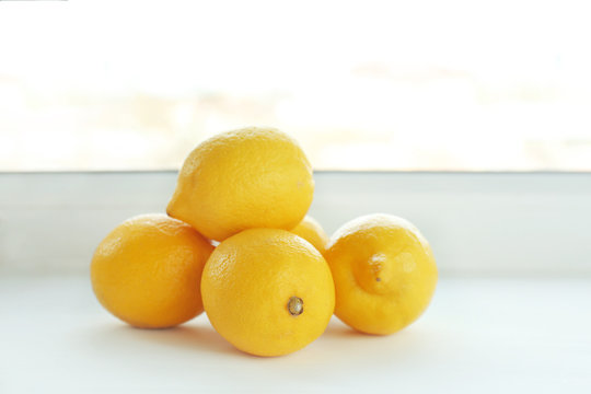 Ripe lemons on windowsill