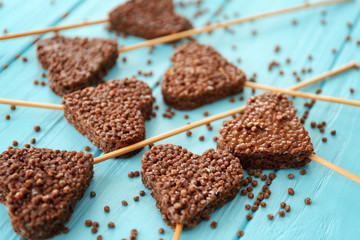 Heart shaped crispy dessert on wooden background
