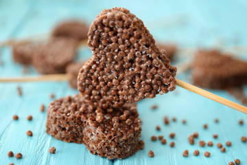 Heart shaped crispy dessert on wooden background