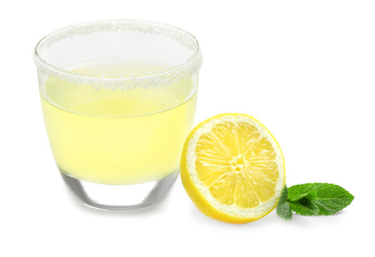Delicious lemon juice in glass on white background