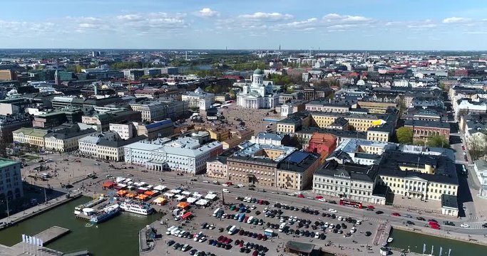 Helsinki harbor, Cinema 4k aerial sideway view of kauppatori market square and the orthodox church, on a sunny summer day, in Helsinki, Finland