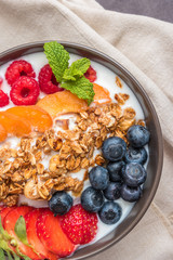 Yogurt with baked granola and berries