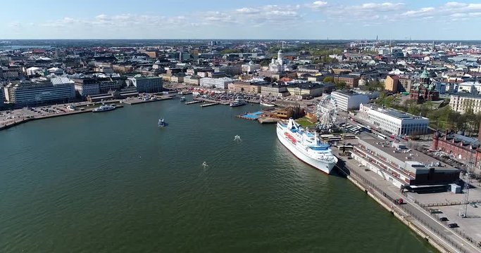 Helsinki harbor, Cinema 4k aerial view flying towards kauppatori market square, on a sunny summer day, in Helsinki, Finland