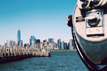 Pay binoculars in Hoboken, New Jersey with the Manhattan skyline in the background. Sunny summer day. Travel, vacation, sightseeing, new york, tourism, and urban living concept © Nicolae Merceanu