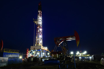 Oil drilling rig in the evening
