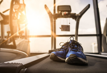 Running shoes on the Treadmill in Fitness Room at the Morning