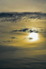 The abstract formation and texture of the clouds over and around the sun. Above the Gulf of Mexico in florida