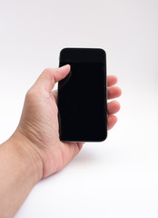 Hand holding smart phone with blank screen on white background