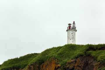 Fototapeta na wymiar Lighthouse on the coast of Avacha Bay