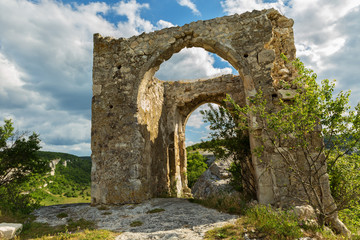 Fototapeta na wymiar Gate on Tapshan Plateau of Cave City in Cherkez-Kermen Valley, Crimea