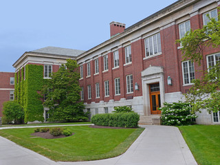 Fototapeta na wymiar Ivy league style brick college building with stone trim