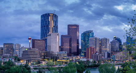 Fototapeta premium Skyscrapers sparkle as the sun sets in Calgary Alberta.