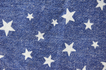 Fabric jeans pattern with stars background.
