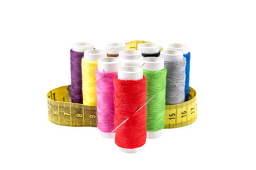 Colorful sewing threads with measuring tape isolated on white background.