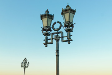 The old retro lamp post and the beautiful blue sky