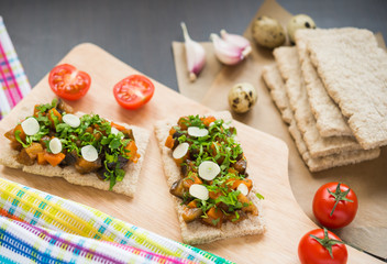 Fototapeta na wymiar Healthy food. Appetizer. Crispbread with steamed vegetables (eggplant, carrot, onion)