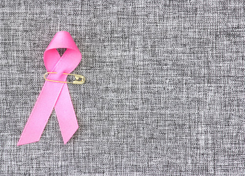 Pink ribbon women breast canser sign background.
