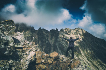 Hiker welcome beautiful mountain valley. Instagram stylization