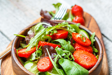 Summer bright salad with strawberries. Weight loss on a vegan diet concept.