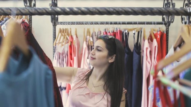 Beautiful girl in a clothing store