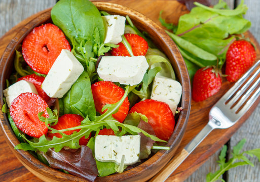 Vegan salad with tofu and strawberries. Love for a healthy vegan food concept