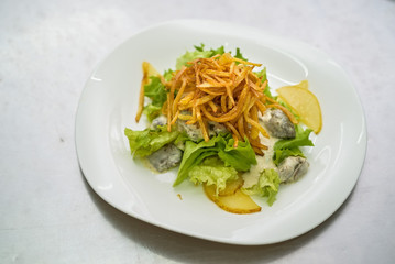 Vegetable salad with liver in cream