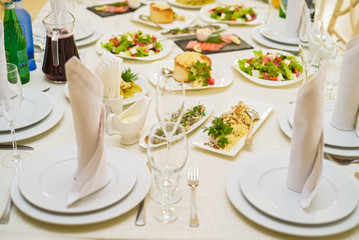 Served restaurant table with salads