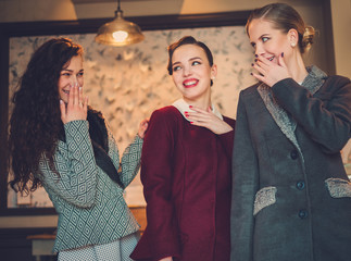 Three elegant young ladies ready for a party