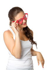 Young girl is holding red sunglasses