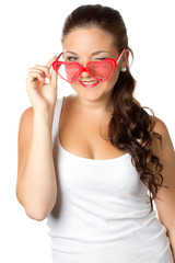 Young girl is holding red sunglasses