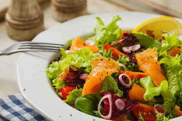 Fresh salad with smoked salmon.