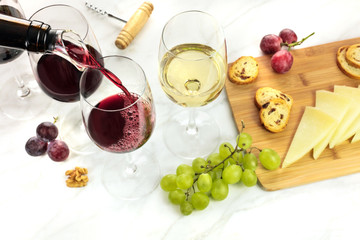 Red wine poured into glass at tasting with copyspace