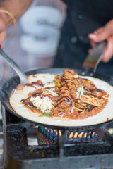 Indian Dosa Cooking on Hot Skillet on Stove