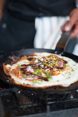 Well Cooked Indian Dosa on a Hot Round Griddle