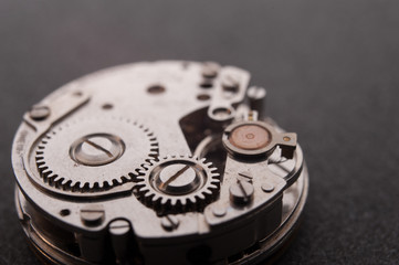 Detail of watch machinery on the table.