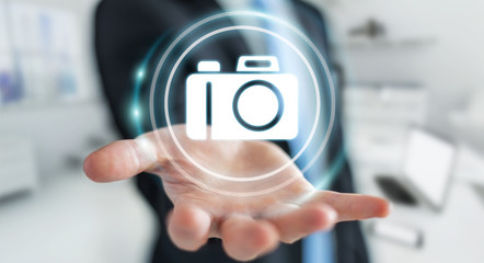 Businessman using modern camera application 3D rendering