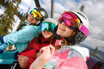 Group cheerful snowboarders on the mountain resort
