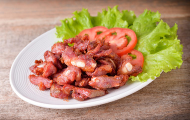 fried pork on wooden background
