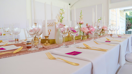 Place Setting at Reception Table for Wedding - Pink, Purple and Gold Decor and Candles