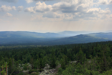 Fototapeta na wymiar Panoramic view of the mountains and cliffs, South Ural. Summer in the mountains.View from the mountains. The nature of the southern Urals. Travel. Mountains.