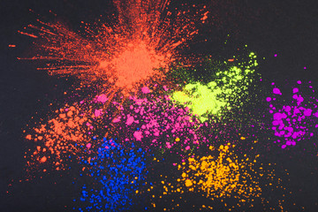 Face powder on a black background, abstract