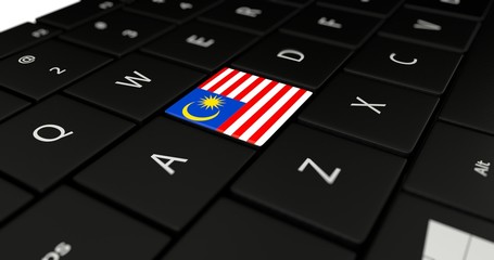 3D rendering close up of Malaysia flag button on laptop keyboard.