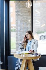 Beautiful Young Woman Talking on the Phone