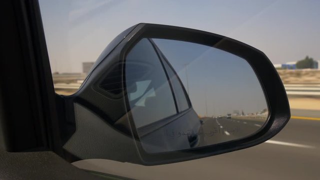 day time dubai city traffic road trip side mirror panorama 4k uae
