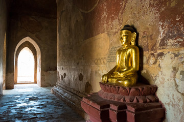 Golden Buddha inside Temple at Bagan, Myanmar.