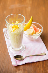 Banana smoothie on a rustic wooden table