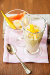 Banana smoothie on a rustic wooden table