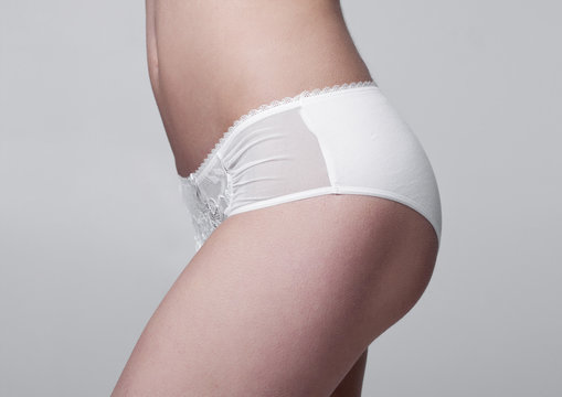 Close up of slim fit healthy girl in white panties