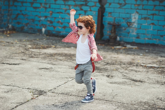 Cute Little Hipster Boy Running Away