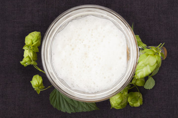 Hops around beer from above.